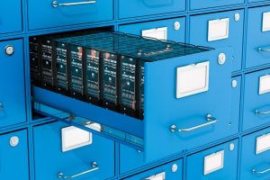computers stored in a file cabinet, representing protecting digital and physical data