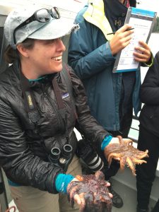 Woman leading a natural history outing for environmental science students in Juneau, Alaska
