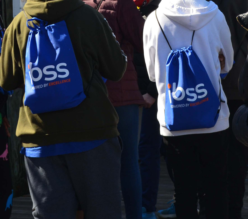students wearing backpacks that were provided by IBSS