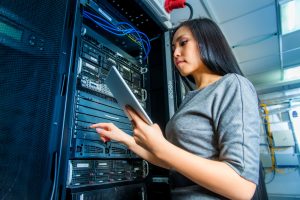 woman working in a server room