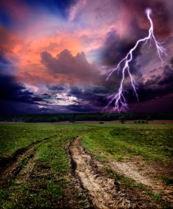 A stormy sky with a streak of lightning
