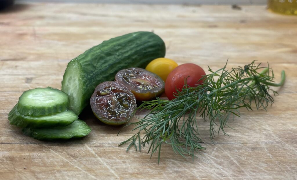 Cucumber, colorful cherry tomatoes and dill
