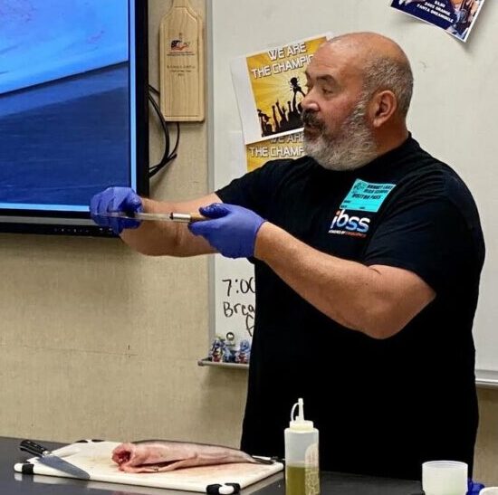 Mark IBSS’ Senior Aquaculturist, instructs the class on safe knife skills while breaking down the smaller-sized black cod filets. Shout out to Jamestown Seafood for graciously donating the black cod/sablefish. Photo by Chef Kahale Ahina Mark